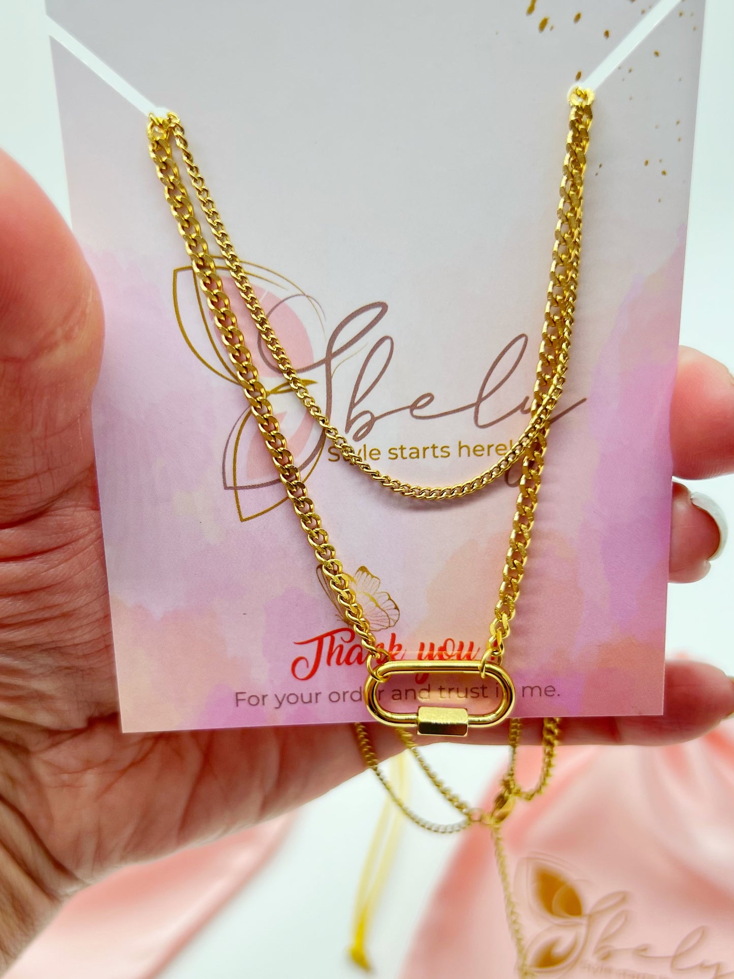 Celeste this exquisite double necklace with a stunning gold- plated charm is the perfect accessory to elevate any outfit