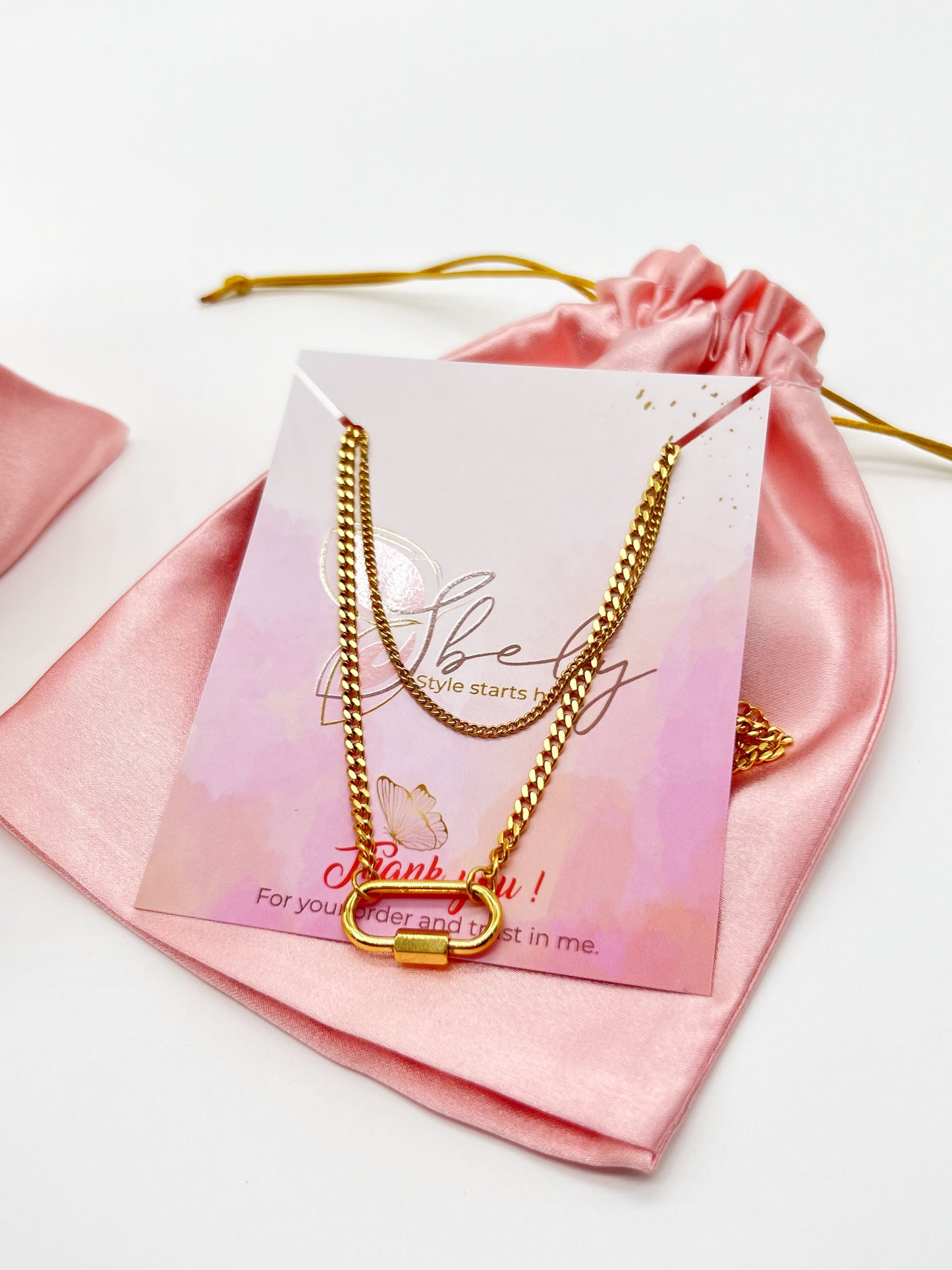 Celeste this exquisite double necklace with a stunning gold- plated charm is the perfect accessory to elevate any outfit