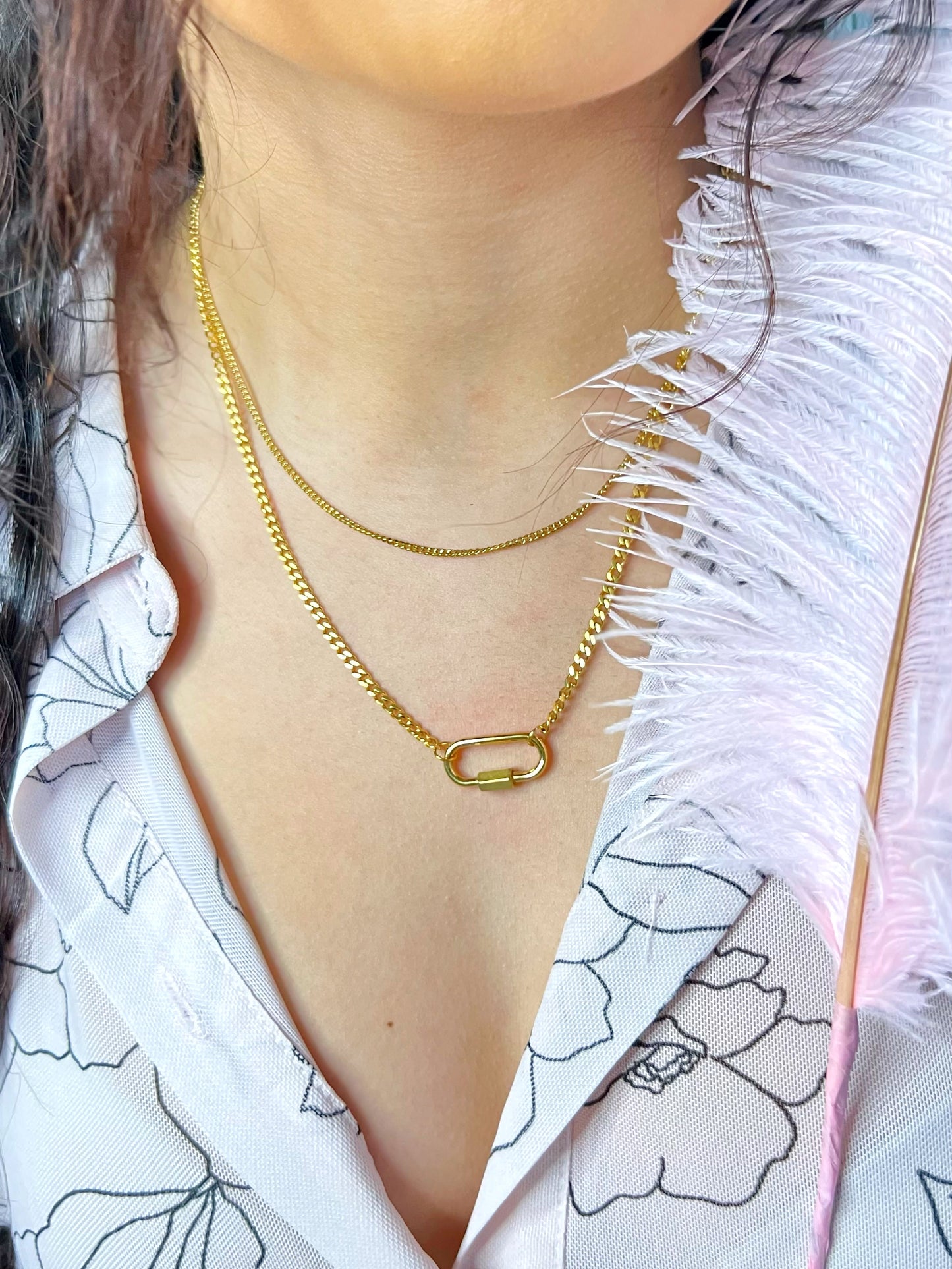 Celeste this exquisite double necklace with a stunning gold- plated charm is the perfect accessory to elevate any outfit